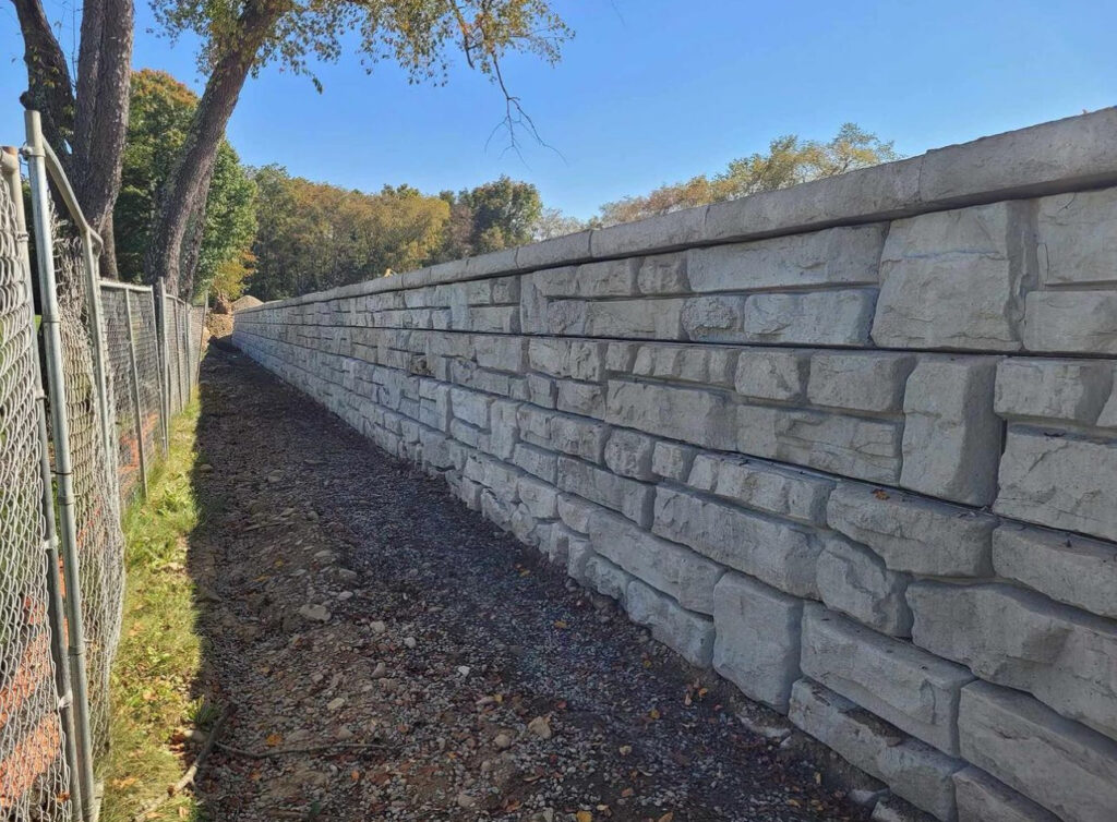 Ledgestone Redi-Rock wall with caps for Waverly School District by American Precast Industries